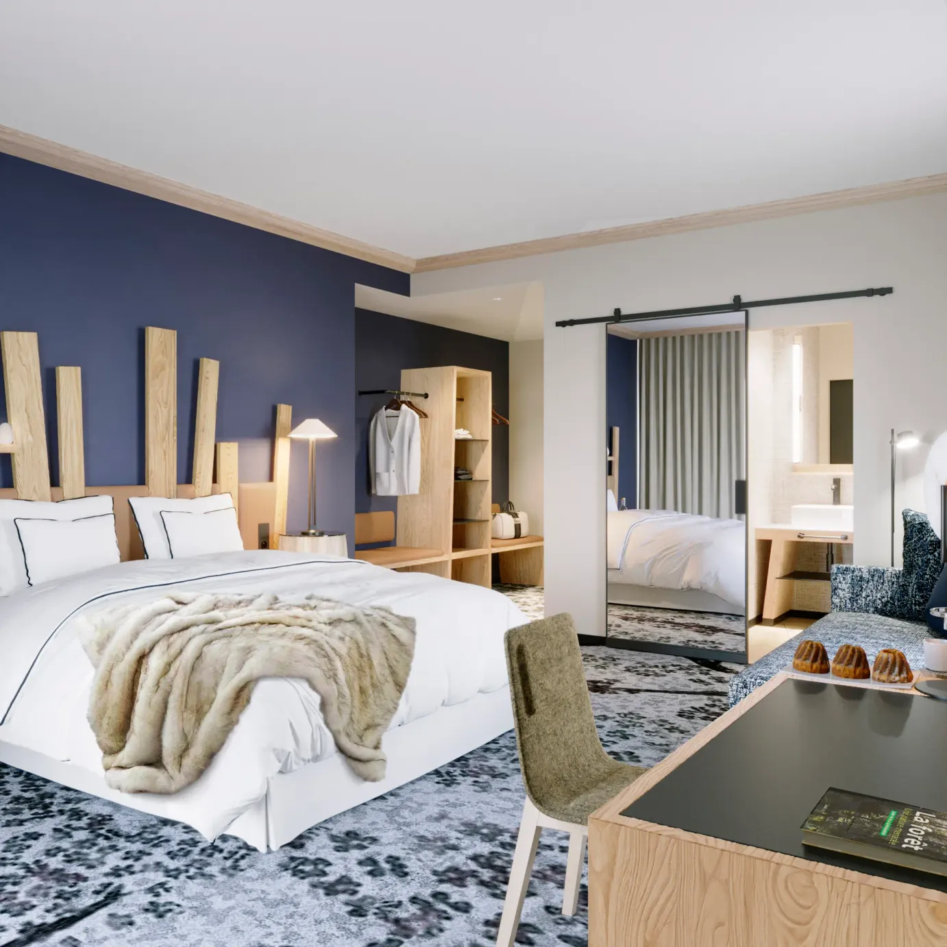 Chambre moderne avec un lit double, une table de chevet, un bureau et une armoire visible à travers une porte ouverte